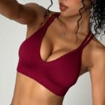 women seamless cross back sports bra red detail close up breathable fabric gym wear