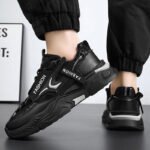 Black chunky sneakers for men with thick sole and modern design