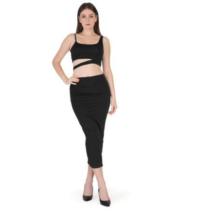 Woman wearing black bodycon co-ord set with sleeveless crop top and fitted midi skirt, stylish party wear outfit for women