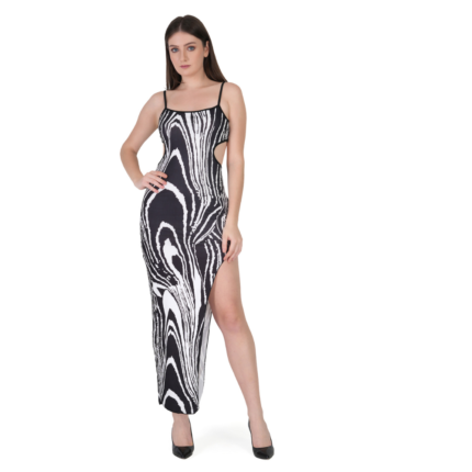 Woman wearing black and white abstract print bodycon maxi dress with spaghetti straps and side slit, stylish party wear outfit for women