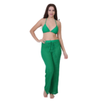 Woman wearing green 3 piece bikini set with beach pants stylish swimwear outfit for beach and pool