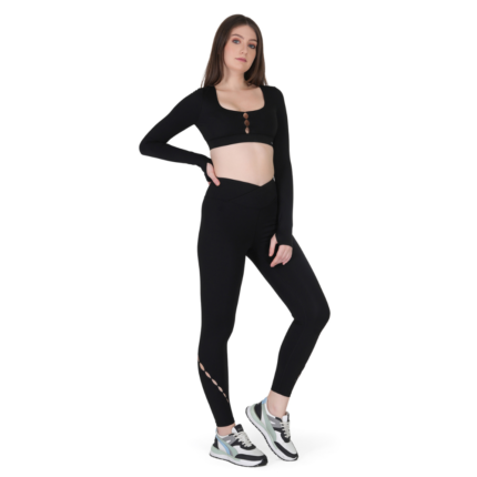 Woman wearing black activewear co-ord set with full sleeve crop top and high waist leggings, stylish gym and workout outfit for women