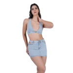 angled pose of women wearing light blue denim co ord set with crop top and mini skirt trendy two piece outfit