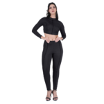 woman wearing black gym wear set long sleeve crop top and leggings activewear front pose