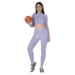 woman wearing lavender gym wear set crop top and leggings holding ball activewear outfit