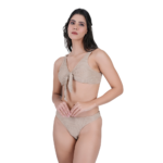 close view of woman wearing beige knotted halter bikini top stylish swimwear detail