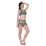 Side view of women’s dark green halter bikini set with floral high-waist shorts, stylish summer beachwear