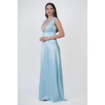 Side view of woman wearing blue maxi evening dress deep V neck elegant long party gown