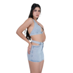 angled side view of women wearing light blue denim co ord set crop top and mini skirt stylish two piece outfit