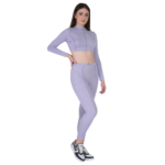 woman wearing lavender gym wear set long sleeve crop top and high waist leggings