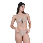 side view of woman wearing beige knotted halter bikini stylish beachwear